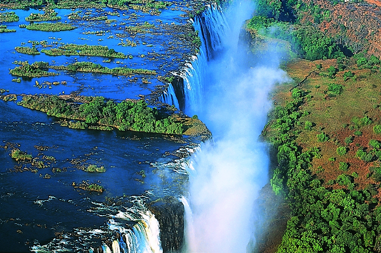 Victoria falls is a transboundary waterfall on the zambezi river located at the border of zambia and zimbabwe. Victoria Falls One of Natural Wonders Travel and Tour